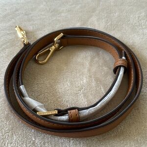 Brand new Michael Kors brown cross body strap for bags.
